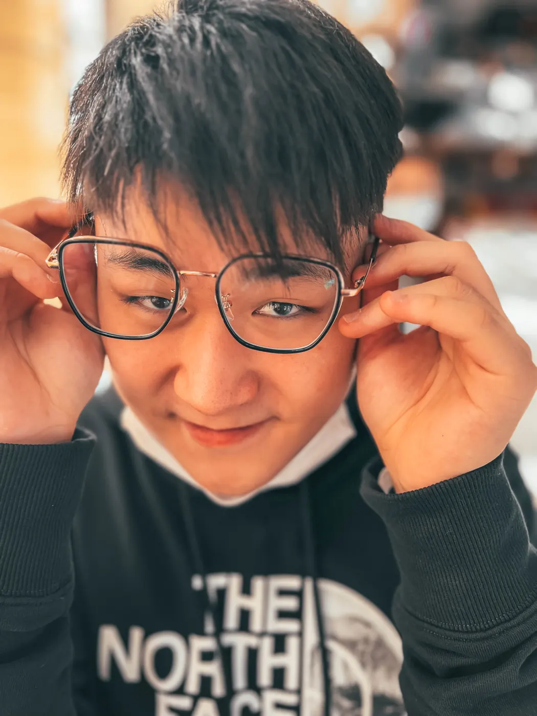 Portrait of Acesley Chan, founder of Surfio, wearing glasses